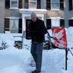 Bill Shea removed snow from the steps at his Hingham home Friday morning.